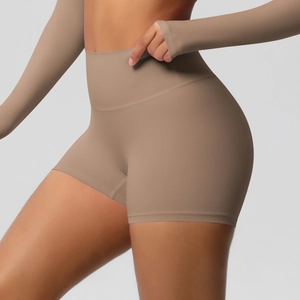 Close-up of high-waisted fitness shorts with lifting effect in brushed brown fabric