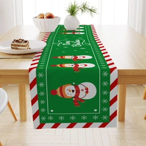 Christmas themed linen table runner with Merry Christmas print on wooden dining table
