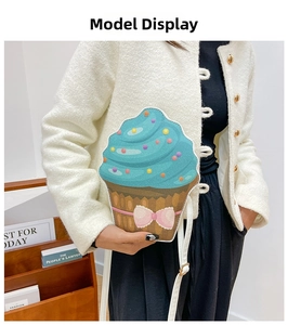 Detail of creative cupcake shaped crossbody bag with colorful sprinkles and pink bow