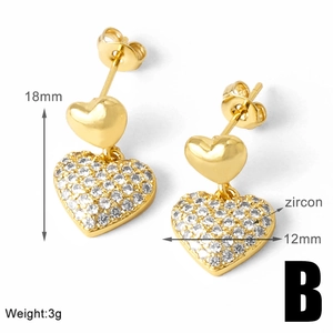 Detail view of heart-shaped drop earrings with zircon pavé and 18mm height measurement