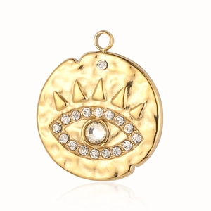 Detail of gold evil eye pendant with hammered texture and sparkling crystals