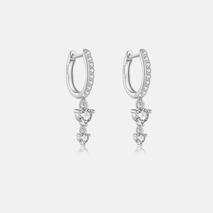 Macro shot of S925 sterling silver earrings with sparkling cubic zirconia charms