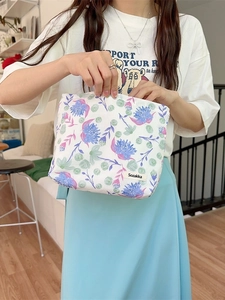 Handheld floral pattern canvas organizer bag with elegant purple flowers for skincare storage
