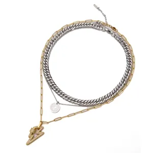 Three-layer stainless steel necklace featuring a crystal lightning bolt and coin pendant