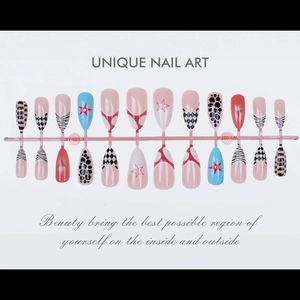 Detailed view of almond-shaped press-on nails with leopard print and star designs