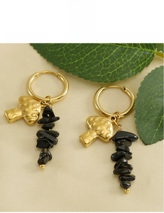 Detail of 18K gold mushroom earrings with black stone beads and lead-free plating