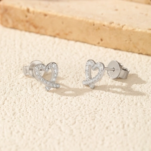 Pair of S925 sterling silver heart stud earrings with sparkling moissanite stones