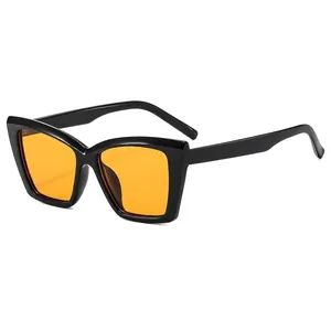 Fashion cat eye sunglasses with black frame and yellow lenses featuring metal hinges