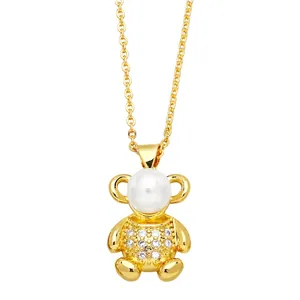 Cute gold bear pendant necklace featuring white pearl head and sparkling crystal body