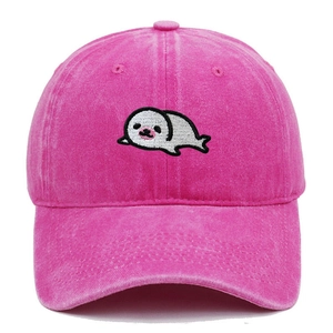 Detail of cute white seal embroidery on a pink washed cotton baseball cap with ventilation