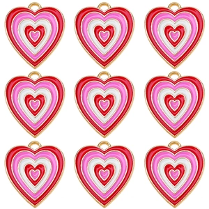 Nine pieces of colorful heart pendants in red and pink enamel for DIY jewelry making