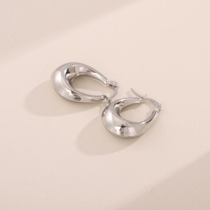 Sleek silver teardrop hoop earrings with high polish finish shown at 45-degree angle