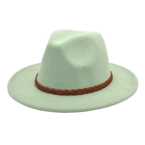 Detailed view of mint green wool fedora with a vintage brown leather braided band decoration