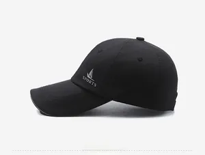 Side view of black quick-dry sports baseball cap with grey logo print and breathable vents
