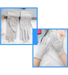 Detail of light gray sun protection gloves with mesh palms and touchscreen fingertips