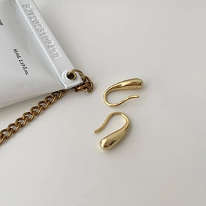Minimalist S925 sterling silver drop earrings in gold finish on white background