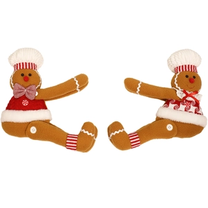 Christmas gingerbread man and woman plush toys in chef outfits on white background