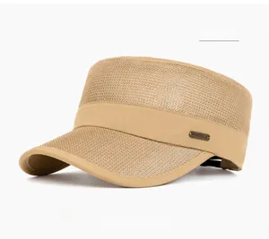 Detail view of khaki mesh flat top cap featuring metal logo for outdoor sports