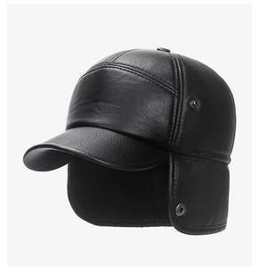 Detailed view of black PU leather winter hat showing grain texture and metal rivet studs