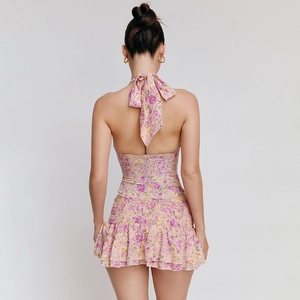 Back view of a pink floral halter top and ruffled skirt set in soft chiffon fabric