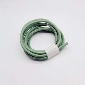 Macro shot of light green 6mm round leather cord with textured finish for DIY bags
