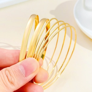 Retro bohemian stackable gold alloy bangle set for women with minimalist multi-layer design
