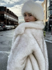 Elegant white faux fox fur coat with matching hat featuring luxurious fluffy texture