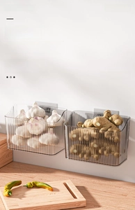 Detail of wall-mounted ginger and garlic storage box with a vertical striped texture