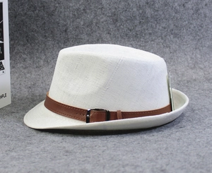 Detail of white woven summer fedora with a brown leather belt and metallic buckle