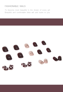 Detail view of retro red checkered and leopard print press-on nails with glossy finish