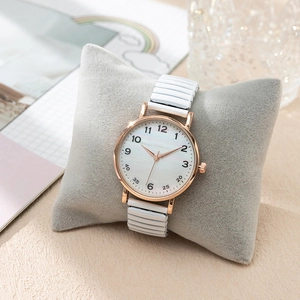 Montre à quartz pour femme avec cadran texturé nacre et bracelet élastique blanc