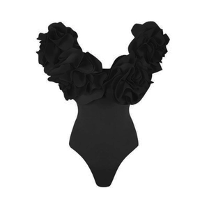 Detailed view of 3D floral ruffles and rose design on a black strapless swimsuit