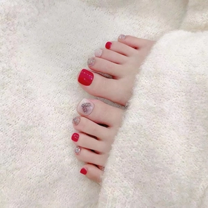 Handmade red and pink press-on toenails with glitter, rhinestones and heart design