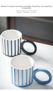 Macro top view of modern ceramic mugs with striped patterns and large round handles