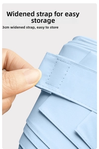 Close-up of light blue umbrella showing the 3cm wide strap and quick-dry fabric detail