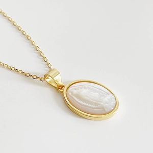 Golden 925 sterling silver Virgin Mary shell necklace with an oval religious pendant