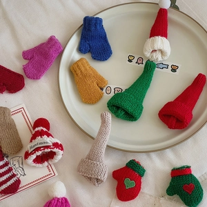 Miniature knitted Christmas hats and mittens with handmade textures for DIY crafts
