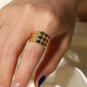 18K gold plated multi-layer open ring featuring round green stones on female hand
