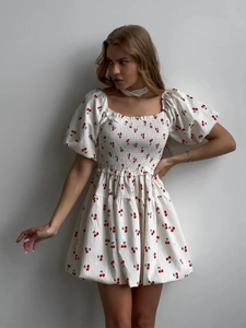 White puff sleeve square neck mini dress with cherry print and tiered ruffled hemline