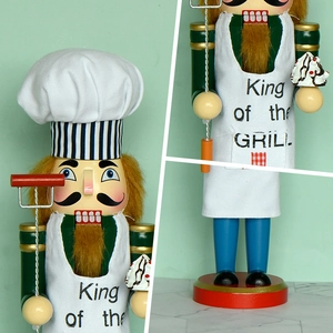 Wooden Nutcracker Chef with King of the Grill apron and BBQ accessories for Christmas decor