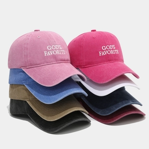 Assorted washed cotton baseball caps with God's Favorite embroidery in multiple colors