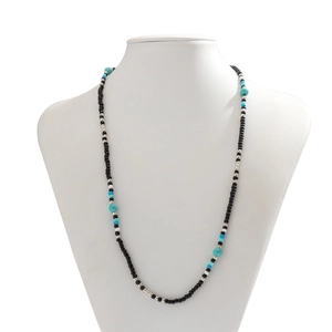 Beaded necklace with turquoise and silver accents on mannequin, chic bohemian jewelry