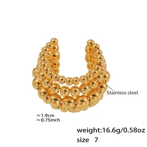 Macro view of gold stainless steel multi-layer bead ring showing dimensions and weight info