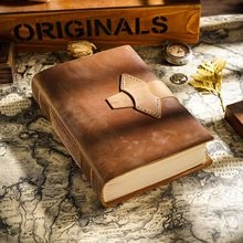 Detail of vintage brown crazy horse leather bookmark with magnetic clasp on old map