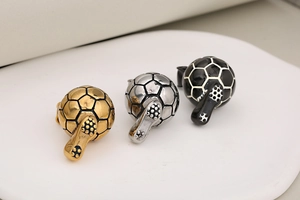 Detailed set of soccer ball and cleat pendants in gold, silver, and black finishes