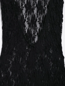 Close-up detail of high-quality black lace fabric featuring intricate floral patterns