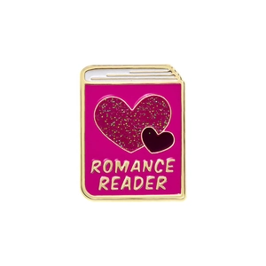 Pink book cartoon enamel pin with glitter hearts and Romance Reader gold lettering