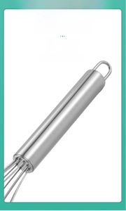 Detail of ergonomic stainless steel handle with hanging loop for easy kitchen storage