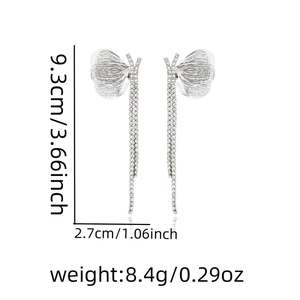 Detail view of silver butterfly tassel earrings with rhinestones and measurement labels