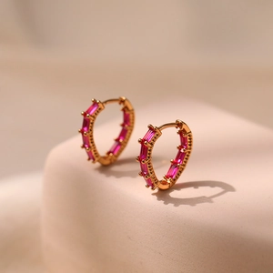 Elegant 18K gold plated hoop earrings with pink rectangular zircon stones on display